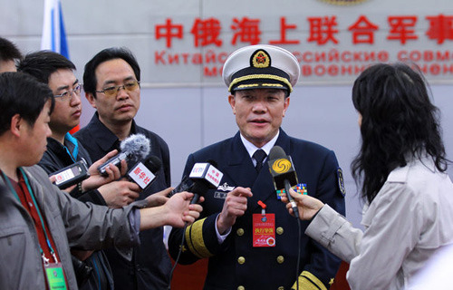 Rear Admiral Duan Zhangxian, deputy chief of staff of the People's Liberation Army Navy, talks to reporters in Qingdao, Shandong province, on Friday. Chinese and Russian navies wrapped up a six-day joint naval exercise on Friday. Zou Hong / China Daily