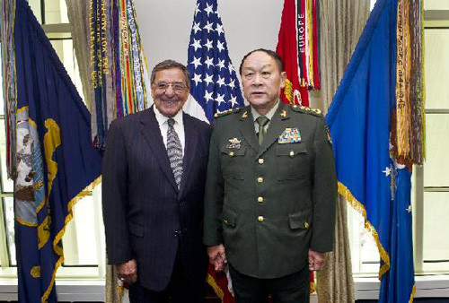 Chinese Defense Minister Liang Guanglie (R) and U.S. Defense Secretary Leon E. Panetta pose for a group photo at the Pentagon in Washington, the United States, May 7, 2012. (Xinhua/Zhang Jun)