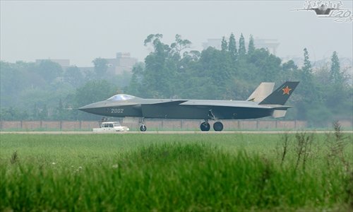 The J-20 stealth fighter, number 2002, completes a test flight at an undisclosed Chinese airport. This is the second J-20 stealth fighter, following the J-20 stealth fighter number 2001. From the photos it is obvious the second J-20 stealth fighter has made a few physical modifications to its structure when compared with the first one. Photo: mil.huanqiu.com 