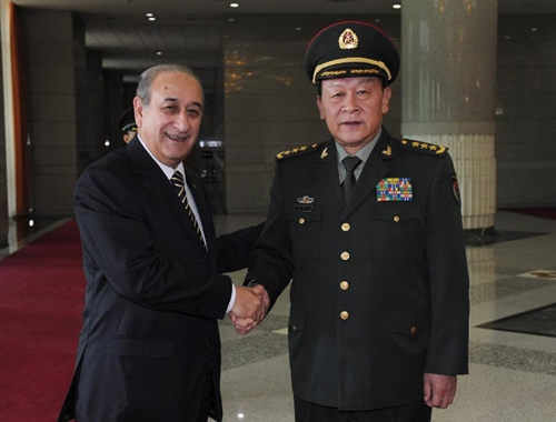 Chinese Defense Minister Liang Guanglie (R) shakes hands with Argentine Defense Minister Arturo Puricelli, in Beijing, capital of China, July 3, 2012. Liang Guanglie held talks with his Argentine counterpart on Tuesday. (Xinhua/Ma Zhancheng)