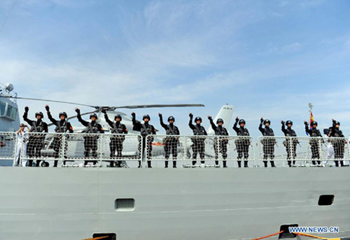 Special force soldiers of the 12th Chinese naval escort flotilla bid farewell at a port in Zhoushan, east China's Zhejiang Province, July 3, 2012. [Xinhua]