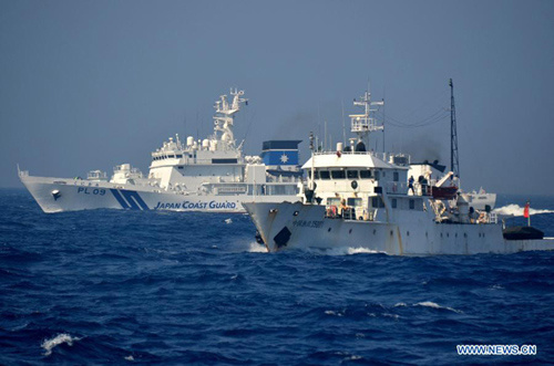 Chinese patrol ships encounter Japanese Coast Guard vessels near the Diaoyu Islands in the East China Sea, July 11, 2012. Three Chinese fishery patrol ships engaged in a verbal confrontation with Japanese Coast Guard ships during a routine patrol in water