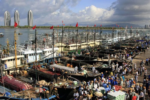 Fishing boats line up in a port in Sanya, Hainan province, on Thursday, before setting off for waters around the Nansha Islands. [Huang Yiming/China Daily]