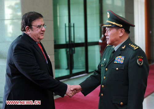 Chinese Defense Minister Liang Guanglie (R) shakes hands with his Afghan counterpart Abdul Rahim Wardak during their meeting in Beijing, capital of China, July 23, 2012. (Xinhua/Zhang Duo)