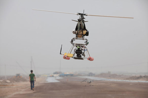 A unmanned surveillance helicopter flies in the sky during a demonstration flight in Lianyungang, a coastal city in East China's Jiangsu province on Sept 23, 2012.(Xinhua Photo)