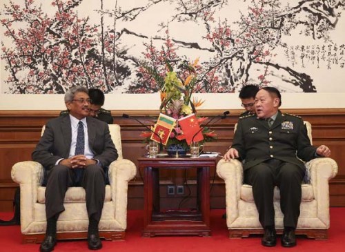 Chinese Defense Minister Liang Guanglie (R) meets with Sri Lankan Secretary of Defence and Urban Development Ministry Gotabaya Rajapaksa in Beijing, China, Nov. 11, 2012. Rajapaksa was in China to attend the 9th China International Aviation and Aerospace Exhibition to be held in the southern city of Zhuhai. (Xinhua/Ding Lin)