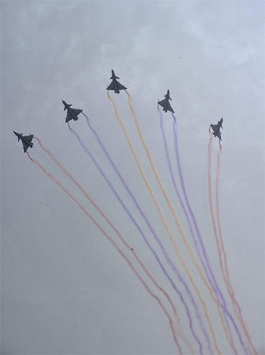 Flights from the China Air Force August 1st Aerobatic Team perform an air show during the opening ceremony of the 9th China International Aviation and Aerospace Exhibition in Zhuhai, south China's Guangdong Province, Nov. 13, 2012. About 650 exhibitors in the aviation and aerospace field took part in the six-day event. (Xinhua/Liang Xu) 