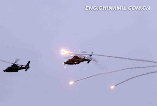 The picture shows that the armed helicopters are launching jammer projectiles. (Photo by Zhang Donghe)