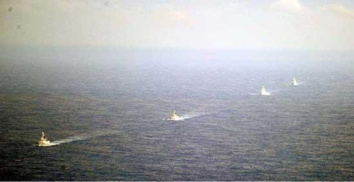 The Chinese Defense Ministry says China's naval drills in the western Pacific Ocean are routine and in accordance with international laws.