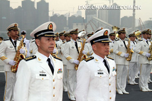 The picture shows Zhang Zheng (front right), captain of the Liaoning ship, Chinas first aircraft carrier, and Mei Wen (front left), political commissar of the Liaoning ship.