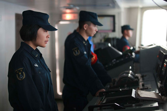 Ma Yan, a helmswoman on the Lanzhou, steers the ship during an ongoing training mission of the South Sea fleet of the PLA. WANG QI / FOR CHINA DAILY