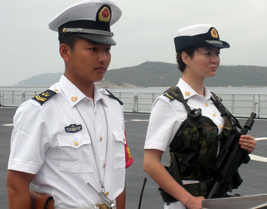 Aliya Arkin, a female Uygur, stands guard on the Jinggangshan, a PLA navy South Sea Fleet landing craft. Wang Qi / for China Daily  