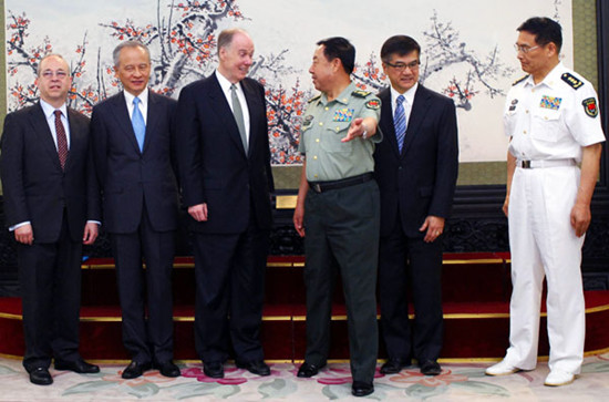 General Fan Changlong (center right), vice-chairman of China's Central Military Commission, and other Chinese officials meet US National Security Adviser Tom Donilon (center left) and his delegation in Beijing on Tuesday. Song Jihe / China News Service
