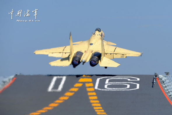 China successfully conducted taking-off and landing exercises of J-15 fighter jets on the country's first aircraft, the Liaoning, on Wednesday. (Photo: chinamil.com.cn)