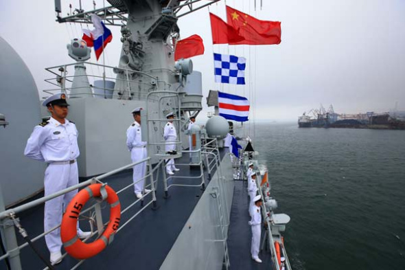 The PLA navy's guided missile destroyer Shenyang arrives at Vladivostok in Russia on Friday, to participate in the Joint Sea 2013 China-Russia joint naval drill. Zha Chunming / Xinhua