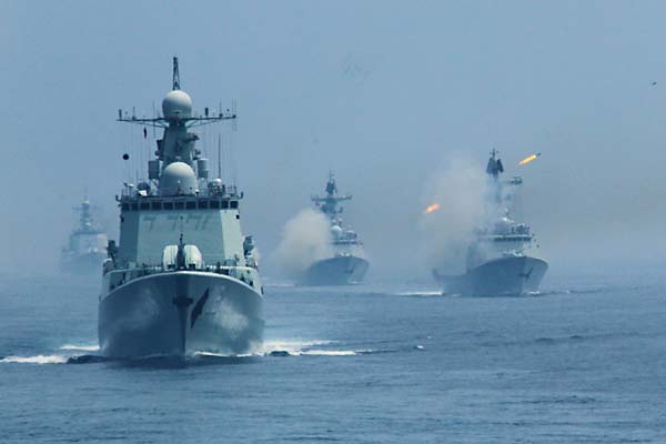 The PLA navy's guided missile destroyer Shijiazhuang sails on Wednesday into the exercise areas where the live ammunition exercises are being held. Zha Chunming / Xinhua 