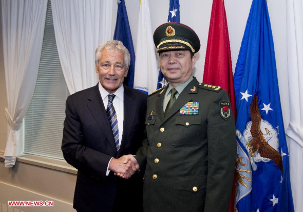 Chinese State Councilor and Defense Minister Chang Wanquan (R) shakes hands with US Secretary of Defense Chuck Hagel during their meeting in the Pentagon in Washington D.C. , the United States, on Aug. 19, 2013. (Xinhua/Zhang Jun)