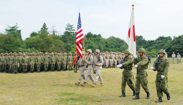 A ceremony is held to mark the start of a joint exercise between the US Marine Corps and the Japan Ground Self-Defense Force at the Aibano training area in Takashima, Shiga prefecture, on Tuesday. Provided to China Daily