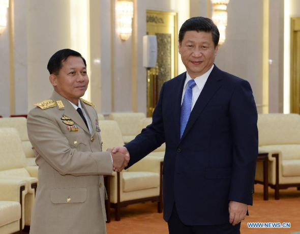 Chinese President Xi Jinping (R), who is also chairman of China's Central Military Commission, shakes hands with Myanmar's Commander-in-Chief of the Defense Services Senior-General Min Aung Hlaing during their meeting in Beijing, capital of China, Oct. 16, 2013. (Xinhua/Ma Zhancheng)
