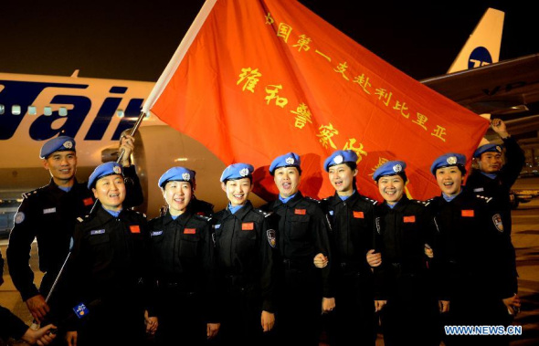 A police riot squad leaves Beijing on Monday night to join an eight-month UN peacekeeping mission in Liberia, said the Ministry of Public Security.It is the first time China has sent a riot police unit to Africa.[Photo/Xinhua]
