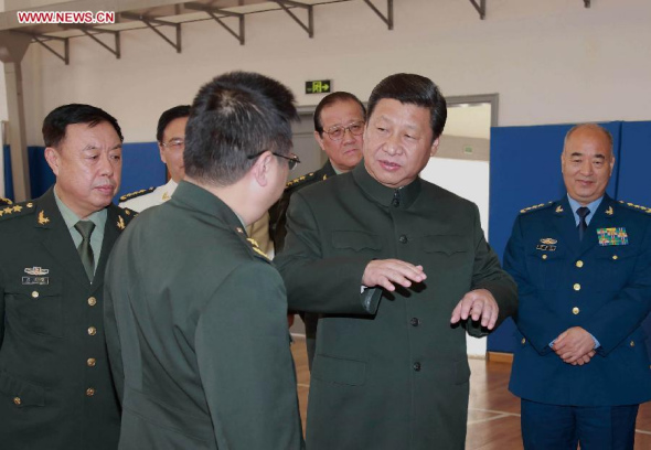 Chinese President Xi Jinping (2nd R), also general secretary of the Communist Party of China (CPC) Central Committee and chairman of the Central Military Commission, talks with scientific research staff members during his inspection tour at the National University of Defense Technology in Changsha, capital of central China's Hunan Province, Nov. 5, 2013. (Xinhua/Li Gang)