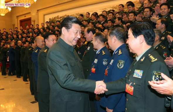 Chinese President Xi Jinping (L, front), also general secretary of the Communist Party of China (CPC) Central Committee and chairman of the Central Military Commission, meets with delegates of the People's Liberation Army (PLA) attending a seminar on Party building, in Beijing, capital of China, Nov. 6, 2013. (Xinhua/Li Gang)