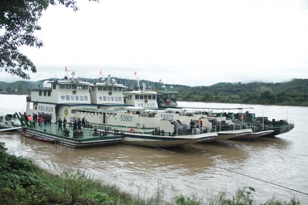 Chinese patrol boats berthed at Maung Mo in Thon Pherng county in western Laos. The patrol followed its usual route on the 512-km round trip that started at Guanlei in Xishuangbanna on Nov 19 and ended at the port of Chiang Saen in Thailand four days later. Photos by Hu Yongqi / China Daily 