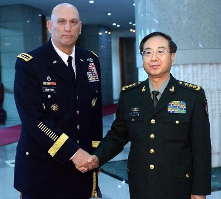 Fang Fenghui (R), Chief of General Staff of the Chinese People's Liberation Army (PLA) and also a member of China's Central Military Commission, shakes hands with U.S. Army Chief of Staff General Raymond Odierno during their meeting in Beijing, capital of China, Feb. 21, 2014. (Xinhua/Li Tao)