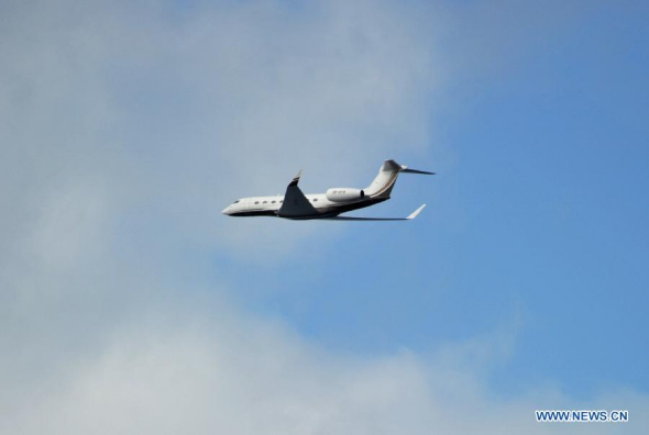 A plane searching for the missing Malaysia Airlines Flight MH370 flies past Chinese icebreaker Xuelong in the southern Indian Ocean on March 26, 2014. Chinese icebreaker Xuelong has arrived in the area where Chinese airborne searchers spotted some suspicious objects on Monday. It has communicated with all the planes passing by the target area for the search. (Xinhua/Zhang Jiansong)