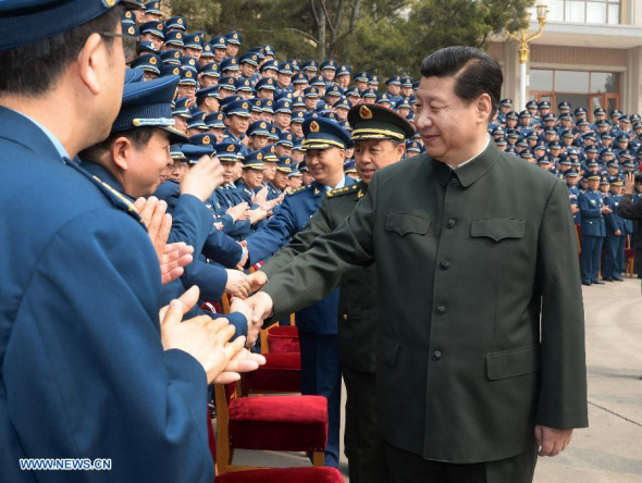 Chinese President Xi Jinping (R front), who is also chairman of the Central Military Commission, meets with air force officers while inspecting the air force's command headquarters on April 14, 2014. (Xinhua/Li Gang) 