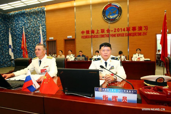 Directors of the Chinese and Russian naval forces arrange the deployment of forces in Shanghai, east China, May 20, 2014. The week-long China-Russia Joint Sea-2014 exercise kicked off on Tuesday.  (Xinhua/Zha Chunming)