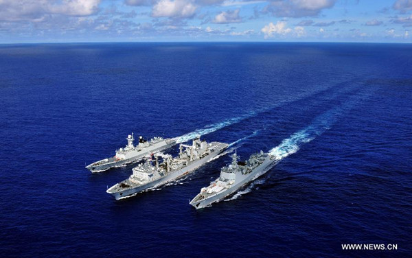 The missile destroyer Haikou (R), missile frigate Yueyang and supply ship Qiandaohu(C) are seen during the supply at sea in Pacific Ocean, during the the Rim of the Pacific (RIMPAC) multinational naval exercises on June 13, 2014. After 6 days' sail, the Chinese fleet participating in the Rim of the Pacific (RIMPAC) multinational naval exercises joined naval forces from Singapore and the United States in waters off Guam on Saturday. (Xinhua/Hu Kaibing)