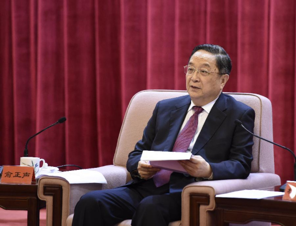 Yu Zhengsheng, a member of the Standing Committee of the Communist Party of China(CPC) Central Committee and chairman of the CPPCC National Committee, addresses a symposium marking the 90th anniversary of the Huangpu (Whompoa) Military Academy, in Beijing, June 17, 2014. (Xinhua/Li Xueren)