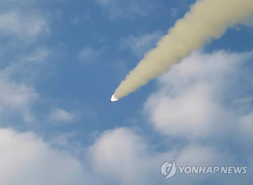 A newspaper of the Democratic People's Republic of Korea (DPRK) releases a photo showing the test-fire of newly developed cutting-edge ultra-precision tactical guided missiles. (Photo / Chinanews.com) 