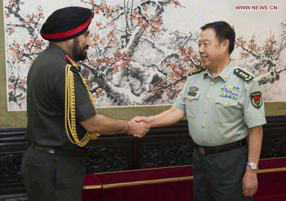 Vice Chairman of China's Central Military Commission Fan Changlong (R) meets with Indian Army Chief General Bikram Singh, who is also chair of the committee of chiefs of staff of the Indian armed forces, in Beijing, capital of China, July 3, 2014. (Xinhua/Huang Jingwen)
