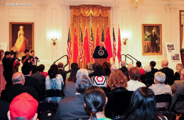 Former President of the Nixon Foundation Sandy Quinn speaks during the opening ceremony of the photo exhibition Salute to Friendship - Images Narrate China-US Collaboration During World War II at the Nixon Library in Yorba Linda City of California, the United States, July 23, 2014.  (Xinhua/Zhang Chaoqun)