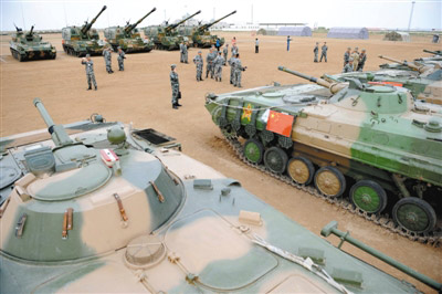 As the 2014 peace mission anti-terror drill continues between five Shanghai Cooperation Organization member states, an armored division of Chinas 38th army opens itself to Chinese and foreign media in a confident display from Chinas military.