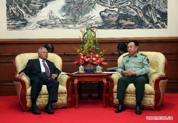 Fan Changlong (R), vice chairman of China's Central Military Commission, meets with visiting Indonesian Defense Minister Purnomo Yusgiantoro in Beijing, China, Sept. 21, 2014. (Xinhua/Liu Weibing)