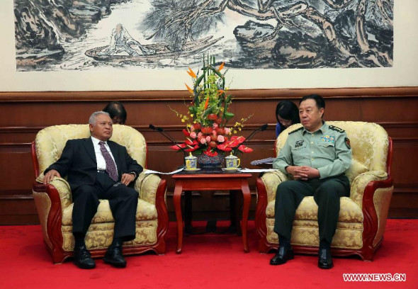 Fan Changlong (R), vice chairman of China's Central Military Commission, meets with visiting Indonesian Defense Minister Purnomo Yusgiantoro in Beijing, China, Sept. 21, 2014. (Xinhua/Liu Weibing)