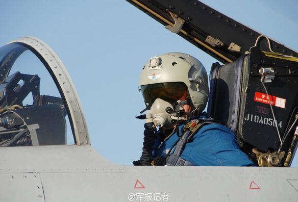 A pilot sits in his jet fighter's cockpit as he prepares to participate in the Gold Helmet air combat contest of the Chinese People's Liberation Army (PLA). The event kicked off in early September in the Gobi desert in Northwest China. [Photo from weibo account of the PLA Daily] 
