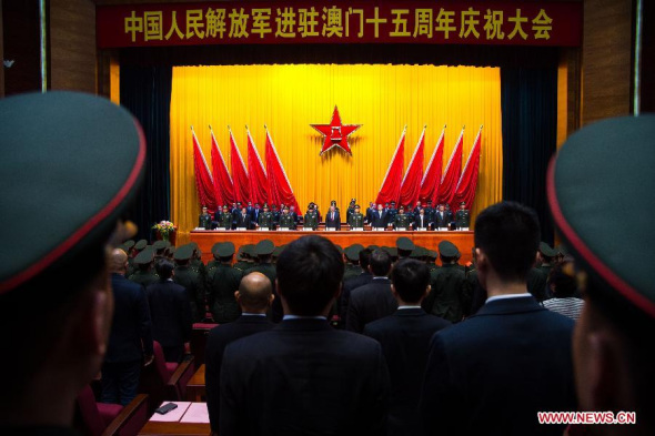 A meeting is held in Macao, south China, on Dec. 9, 2014 to celebrate the 15th anniversary of the deployment in Macao of the Chinese People's Liberation Army (PLA) Garrison. (Xinhua/Cheong Kam Ka) 