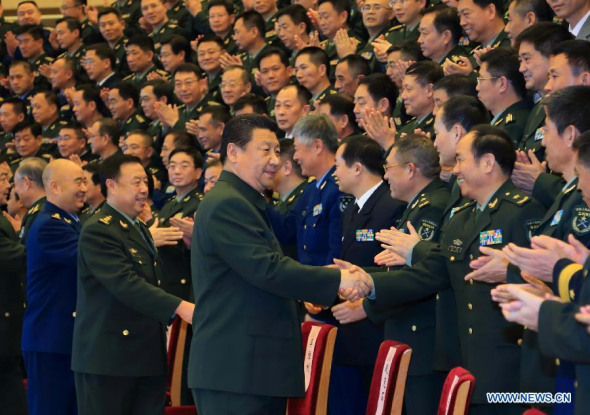 Chinese President Xi Jinping (R front), also general secretary of the Communist Party of China (CPC) Central Committee and chairman of the Central Military Commission, meets with military officers for military diplomacy in Beijing, capital of China, Jan. 29, 2015. (Xinhua/Li Gang) 