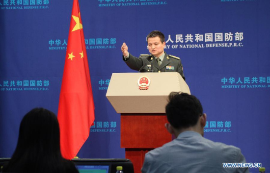 Yang Yujun, spokesman of the Ministry of National Defense (MND) of the People's Republic of China, answers questions on this year's military exercises plan, anti-corruption campaign, China-Japan talks on maritime crisis management mechanism and other issues at a regular press conference in Beijing, capital of China, Jan. 29, 2015. This is the first regular press conference in 2015 of the MND. (Xinhua/Mei Changwei)