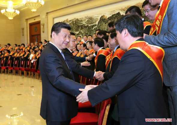 Chinese PresidentXi Jinping(L, front) and other top leaders includingLi Keqiang,Liu YunshanandZhang Gaolimeet with representatives prior to a Spring Festival event celebrating unity between the government, military and the public, in Beijing, China, Feb. 11, 2015. (Xinhua/Li Gang)