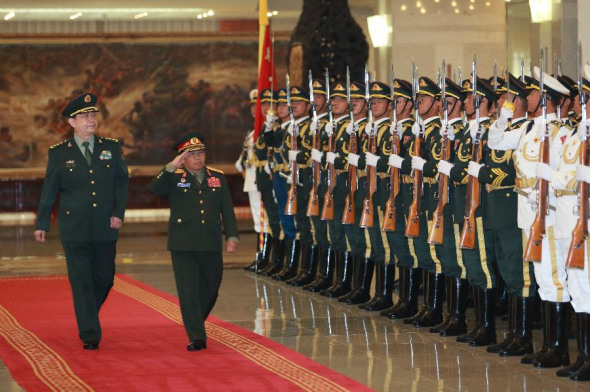 Chinese Defense Minister Chang Wanquan (L) and visiting Lao Defense Minister Sengnuan Saiyalath inspect the guards of honor before their talks in Beijing, capital of China, July 8, 2015. (Photo: Xinhua/Ding Haitao)