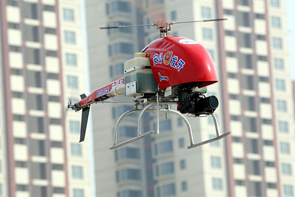 An unmanned police helicopter performs during an exercise in Yantai, Shandong province, in March. Shen Jizhong / Xinhua