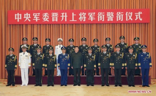 Chinese President Xi Jinping (C, front), also general secretary of the Communist Party of China (CPC) Central Committee and chairman of the Central Military Commission (CMC), poses for a group photo with millitary officers in Beijing, capital of China, July 31, 2015. Xi presented certificates of command to ten senior military and police officers who were conferred the rank of general by the CMC at a promotion ceremony here Friday. (Xinhua/Li Gang)
