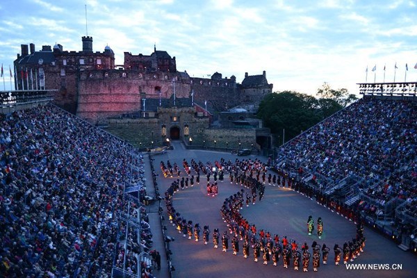 Members of a military band perform during the opening ceremony of the 66th Royal Edinburgh Military Tattoo in Edinburgh of Scotland, on the evening of Aug. 7, 2015. The theme of East meets West with the 66th Royal Edinburgh Military Tattoo aims to provide the opportunity for the military musicians and cultural groups from across the world to share a unique stage, to showcase their differences and their wonderful similarities. (Photo/Xinhua)