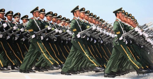 Soldiers take part in a training for a military parade in Beijing, capital of China, July 23, 2015. China will hold a grand military parade on Sept. 3 to mark the 70th anniversary of the victory of the Chinese People's War of Resistance Against Japanese Aggressions and the World Anti-Fascist War. (Xinhua/Tian Feng)
