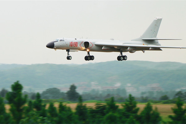 A PLA Air Force H-6K bomber conducts a training flight in Guangzhou, Guangdong province, in August. (Photo/Xinhua)